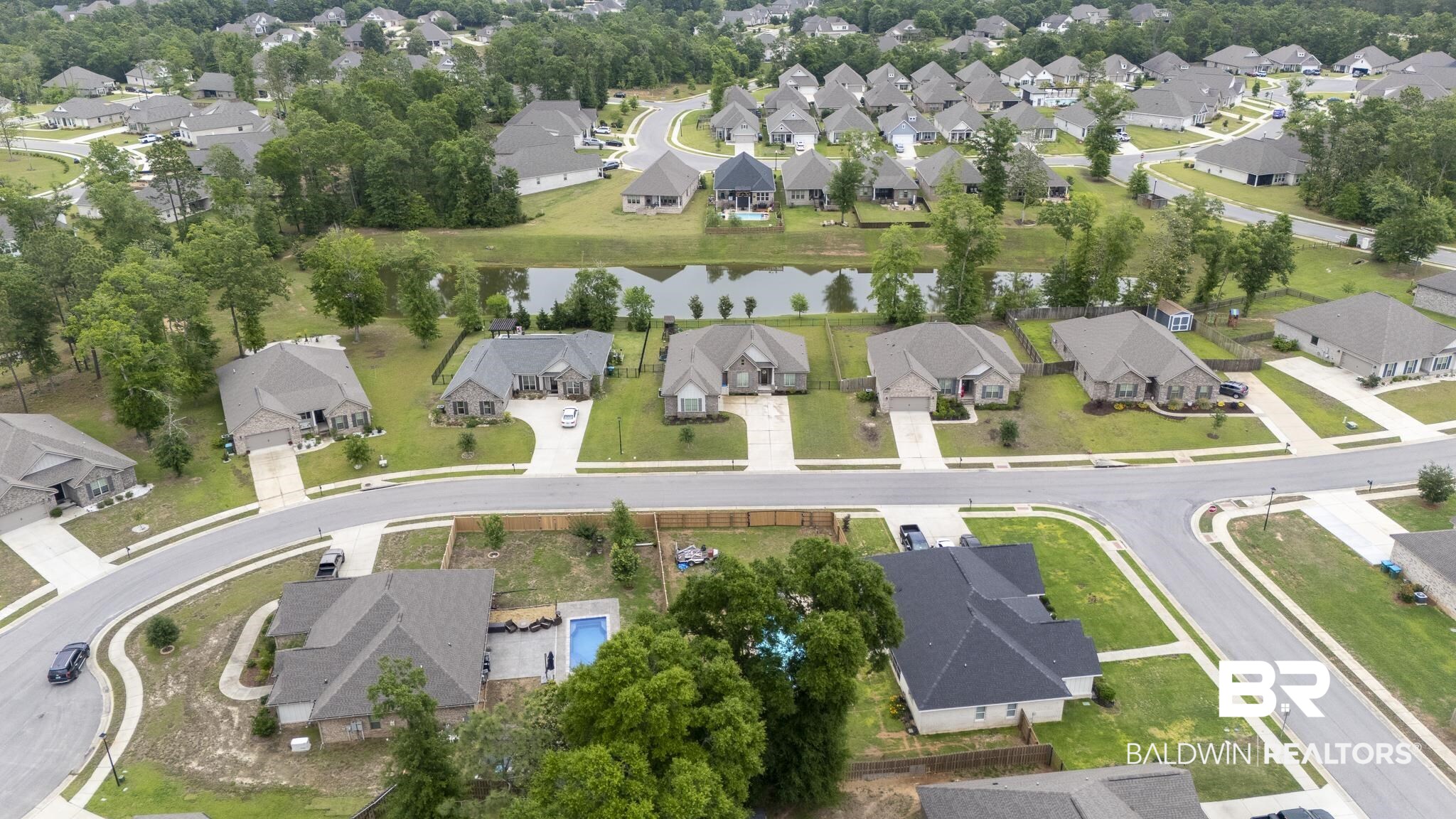 12672 Squirrel Drive Daphne, AL 36527 - Photo 49 of 49 Aerial depiction of a residential community featuring single-story homes with asphalt shingle roofs and concrete driveways, surrounded by mature trees and manicured lawns