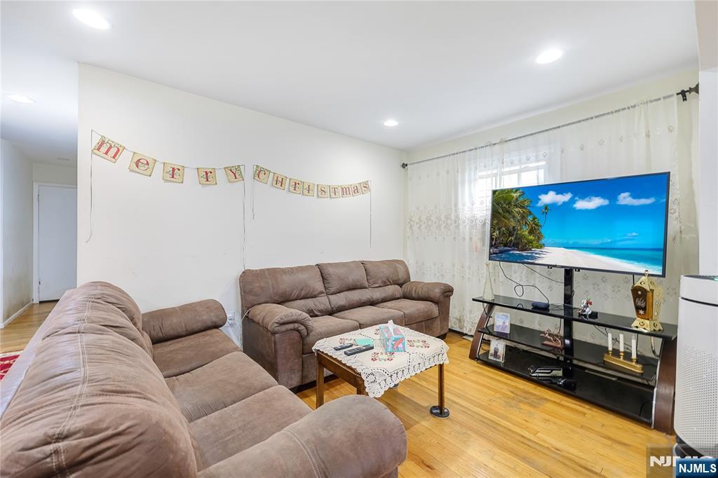 698 Fairview Avenue Fairview, NJ 07022 - Photo 17 of 40 a living room with furniture and a flat screen tv