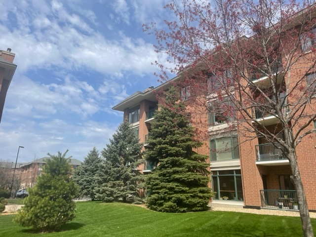 875 East 22nd Street, Unit 420 Lombard, IL 60148 - Photo 2 of 5 a view of a house with a yard