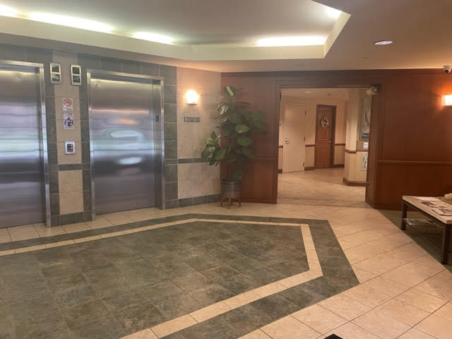 875 East 22nd Street, Unit 420 Lombard, IL 60148 - Photo 5 of 5 a view of a hallway with wooden floor