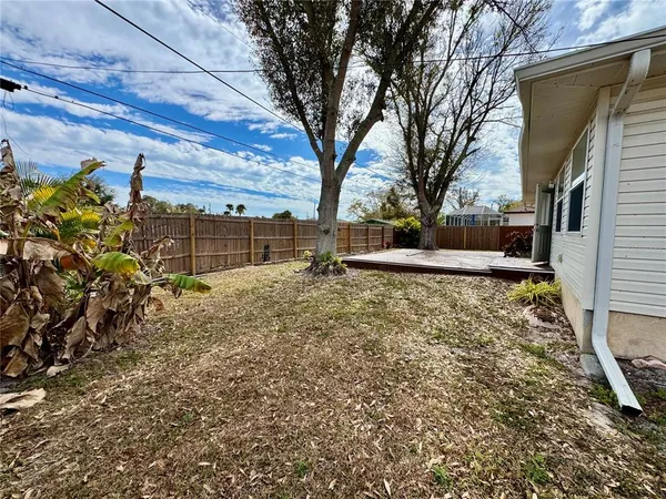 a backyard of a house with lots of green space
