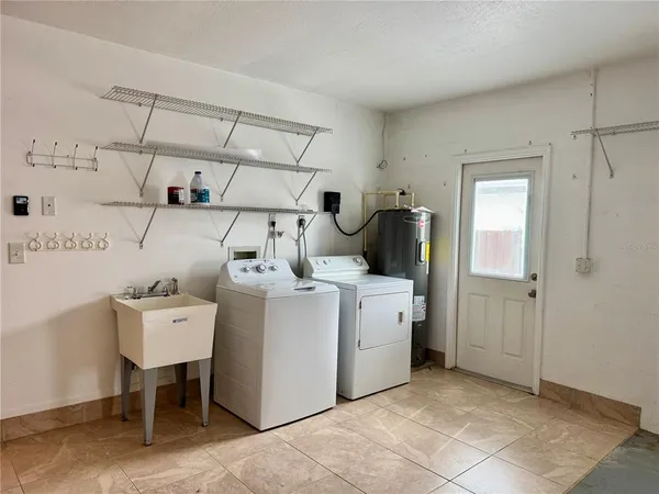 a utility room with dryer and washer