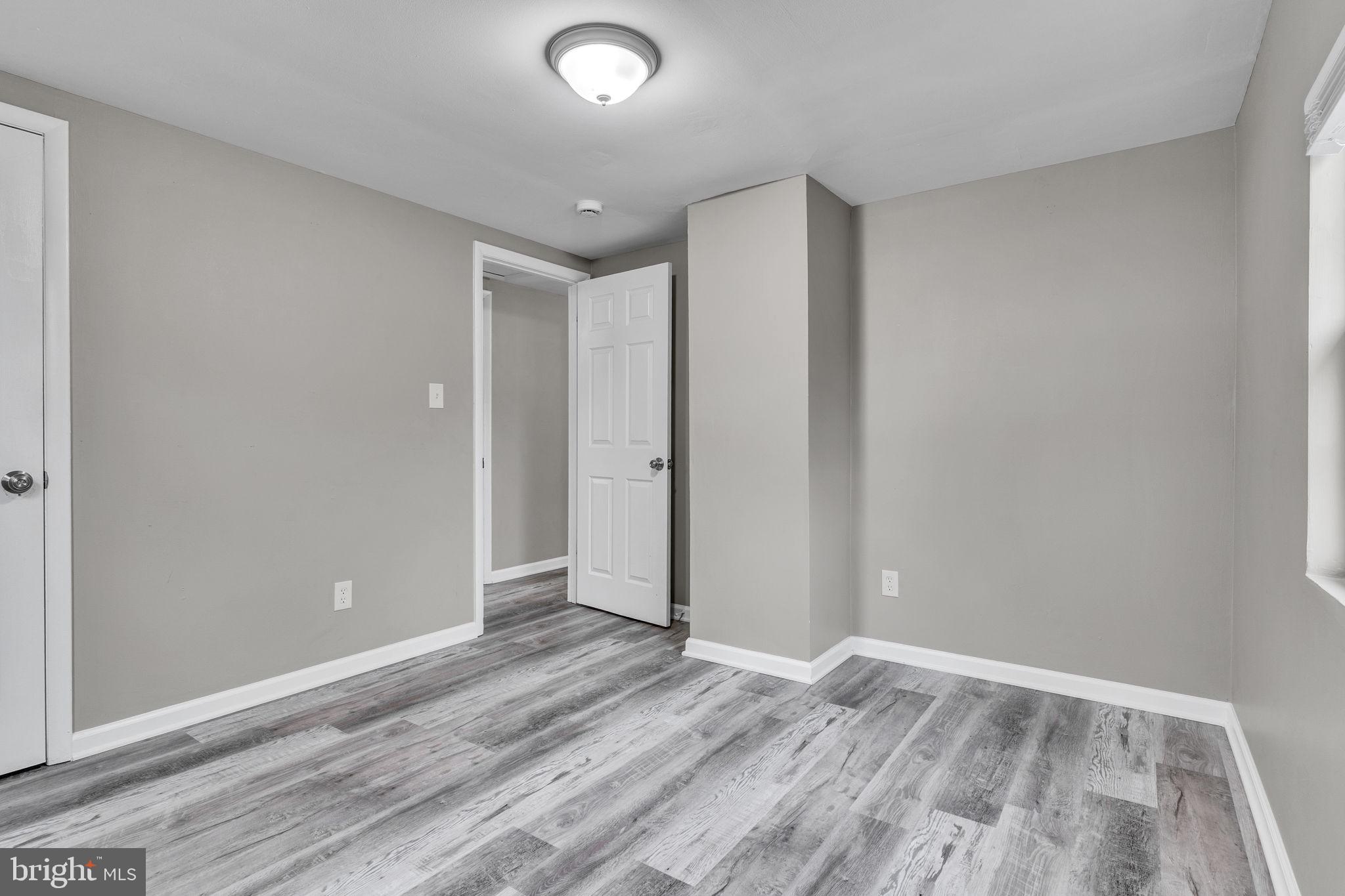 24338 Longview Road Chaptico, MD 20621 - Photo 12 of 19 wooden floor in an empty room