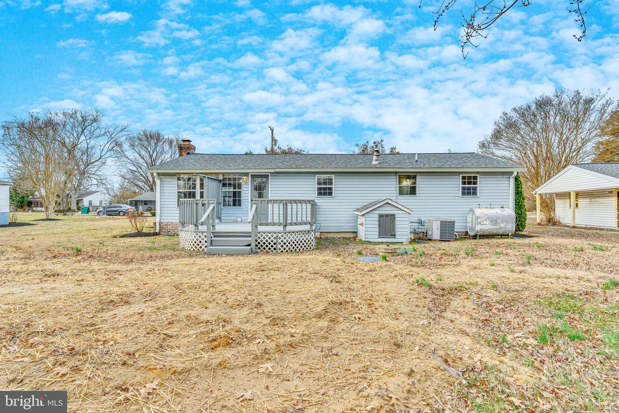 24338 Longview Road Chaptico, MD 20621 - Photo 5 of 19 a front view of a house with garden