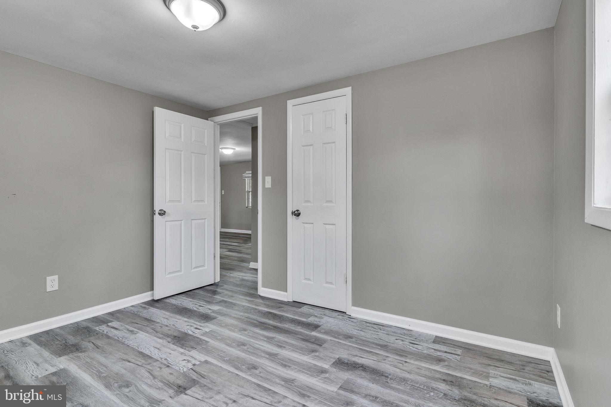 24338 Longview Road Chaptico, MD 20621 - Photo 10 of 19 a view of an empty room with wooden floor