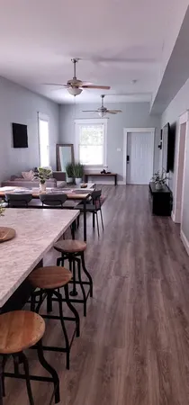 a kitchen with a table chairs and a refrigerator