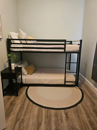 a bedroom with a bed and a dresser
