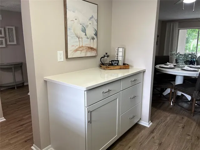 a utility room with a sink and a mirror
