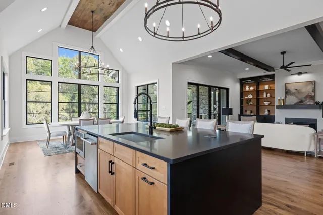 a open kitchen with sink cabinets and wooden floor