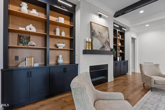 a view of walk in closet and wooden floor