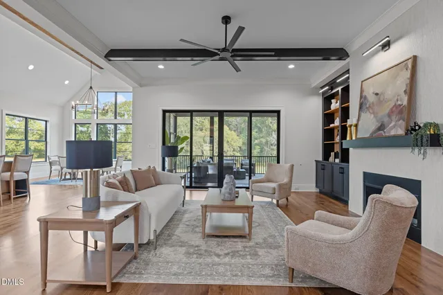 a view of empty room with wooden floor and closet