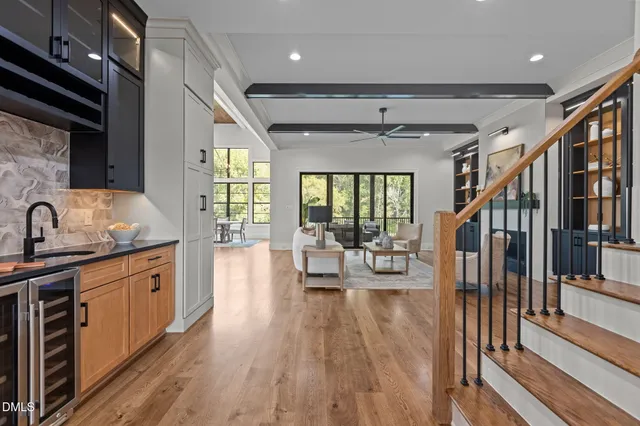 a bedroom with a bed rug and wooden floor