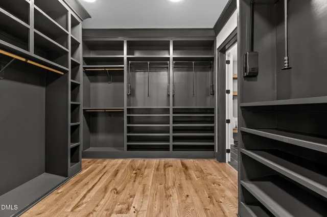 a bathroom with a double vanity sink and mirror
