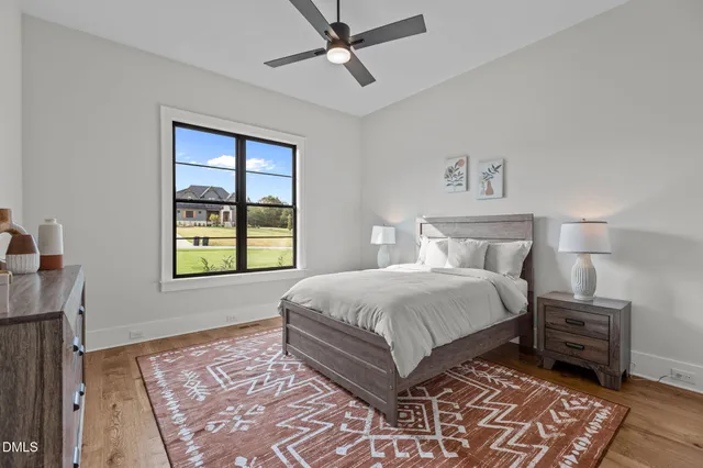 a bathroom with a double vanity sink toilet and shower