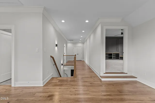 a view of a balcony with floor to ceiling windows