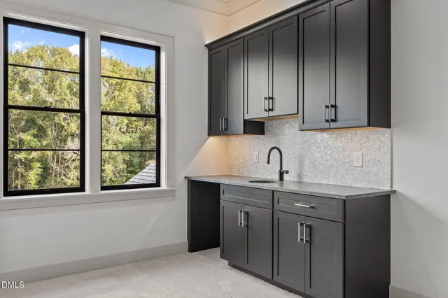 a view of a house with swimming pool and a yard