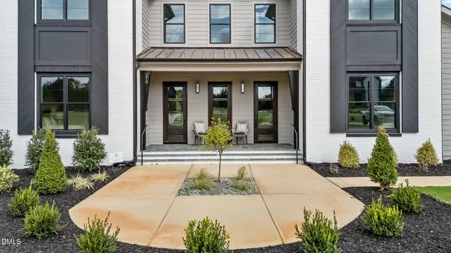 a large kitchen with a table and chairs