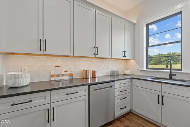 a living room with fireplace furniture and a wooden floor