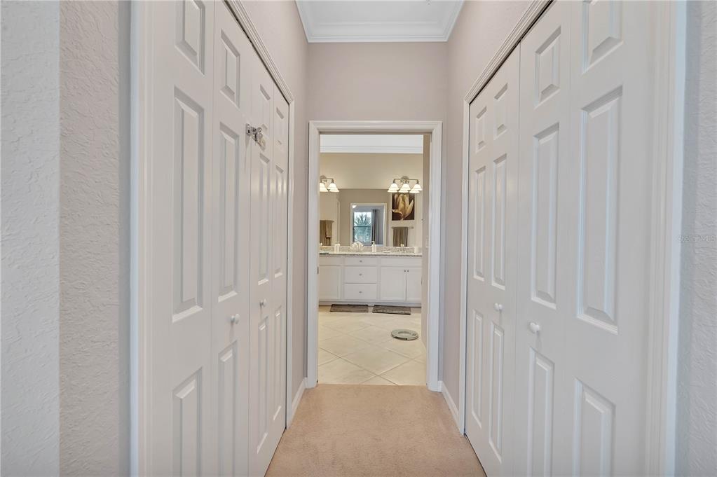 5815 Wake Forest Run, Unit 103 Lakewood Ranch, FL 34211 - Photo 17 of 63 a view of a bathroom from the hallway