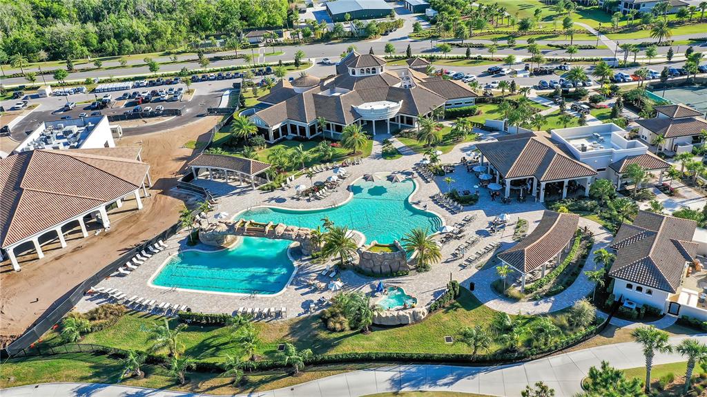 5815 Wake Forest Run, Unit 103 Lakewood Ranch, FL 34211 - Photo 31 of 63 an aerial view of residential houses with outdoor space
