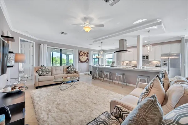 a living room with furniture and a large window