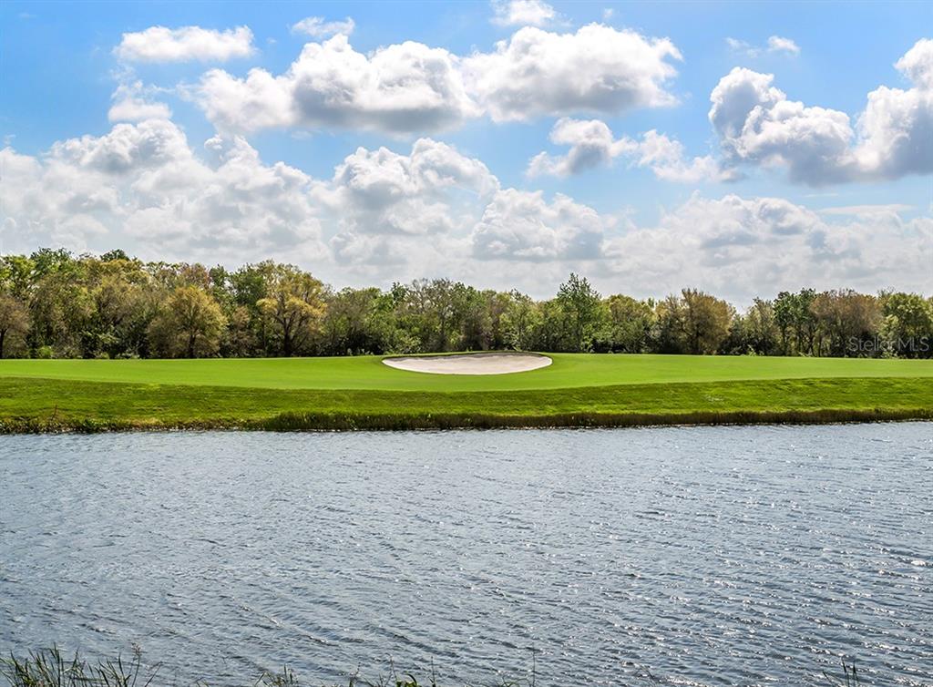 5815 Wake Forest Run, Unit 103 Lakewood Ranch, FL 34211 - Photo 60 of 63 a view of a golf course