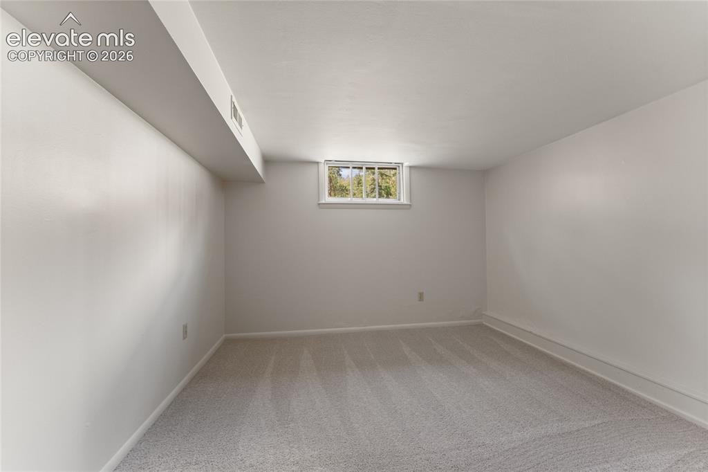 7755 Topeka Avenue Cascade, CO 80809 - Photo 25 of 38 Basement bedroom