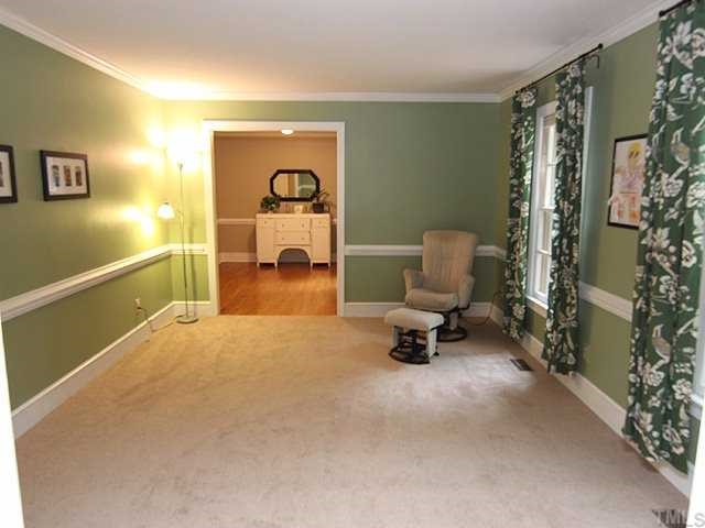7908 Jenkins Ridge Court Raleigh, NC 27613 - Photo 2 of 12 a living room with furniture and a table