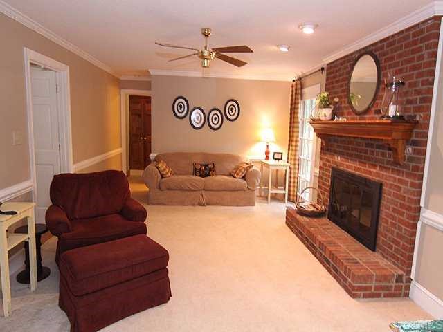 7908 Jenkins Ridge Court Raleigh, NC 27613 - Photo 6 of 12 a living room with furniture and a fireplace