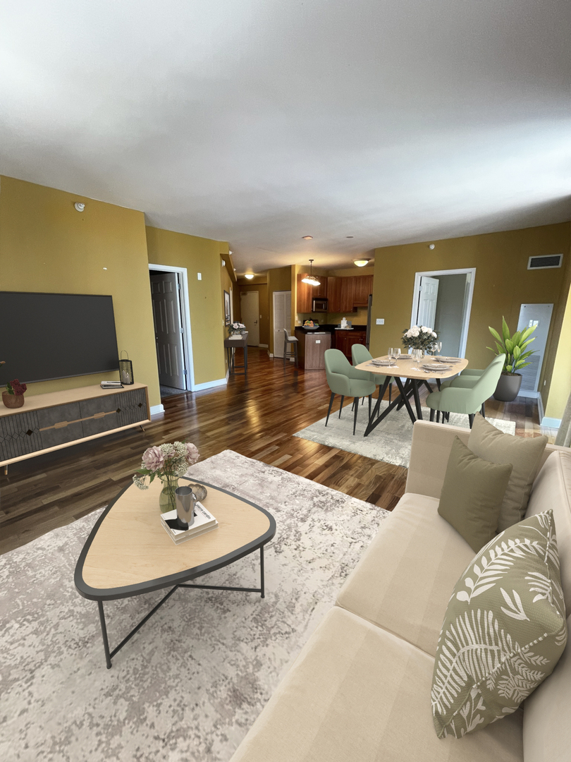 1101 South State Street, Unit 2104 Chicago, IL 60605 - Photo 11 of 37 a living room with furniture and a flat screen tv