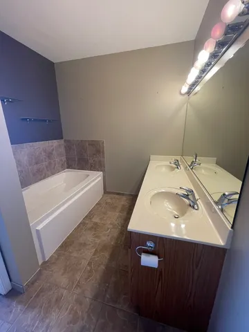 a bathroom with a sink and a bathtub
