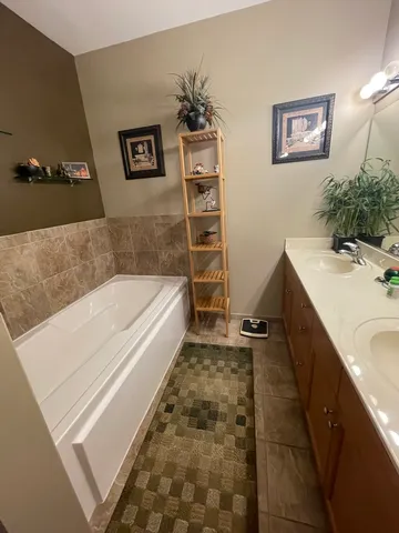 a bathroom with a bathtub and a sink
