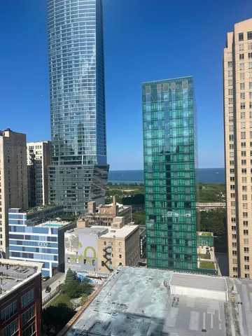 a view of a patio with table and chairs