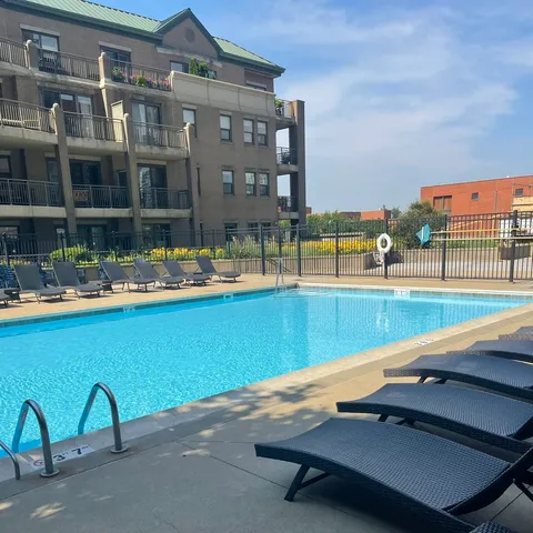 a view of a swimming pool with a lounge chairs