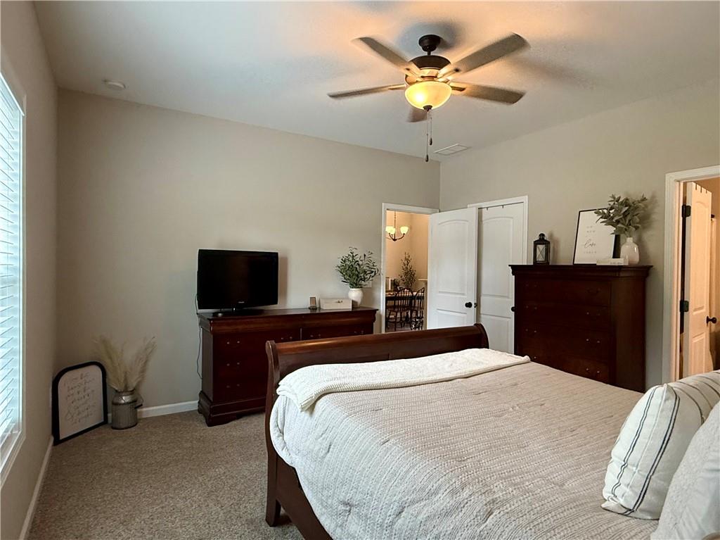 1776 Pleasant Grove Road Temple, GA 30179 - Photo 19 of 45 a bedroom with a bed and a flat tv screen on dresser