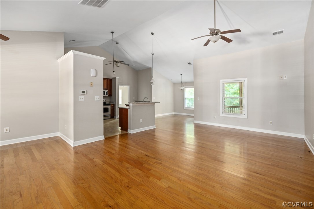 1305 Eastham Road Bumpass, VA 23024 - Photo 11 of 49 Unfurnished living room featuring high vaulted cei