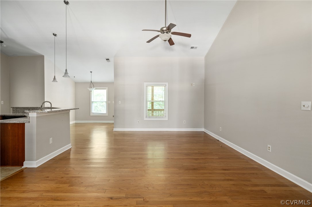 1305 Eastham Road Bumpass, VA 23024 - Photo 13 of 49 Unfurnished living room featuring high vaulted cei
