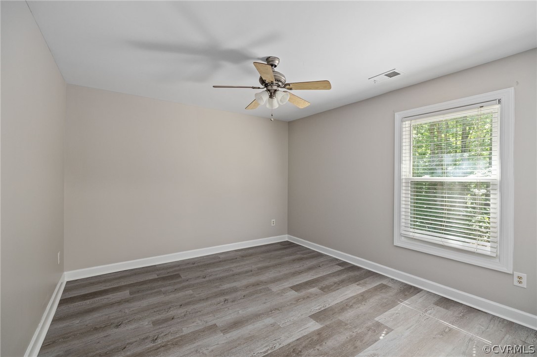 1305 Eastham Road Bumpass, VA 23024 - Photo 34 of 49 Bedroom #3 featuring hardwood / wood-style floorin
