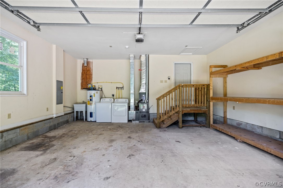 1305 Eastham Road Bumpass, VA 23024 - Photo 36 of 49 2 car garage with washer and dryer, a garage door