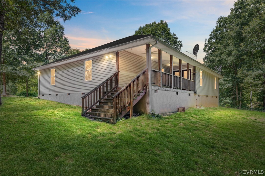 1305 Eastham Road Bumpass, VA 23024 - Photo 6 of 49 Back house at dusk with a yard
