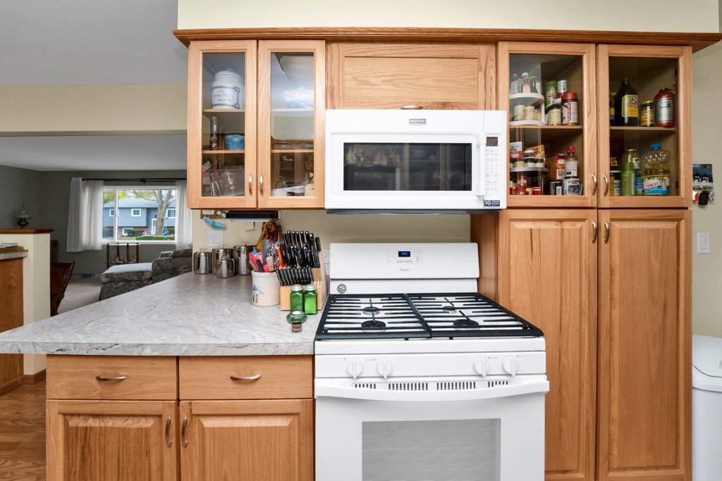 16 Tweed Road Fox Lake, IL 60020 - Photo 11 of 27 a kitchen with stainless steel appliances granite countertop a stove and a microwave