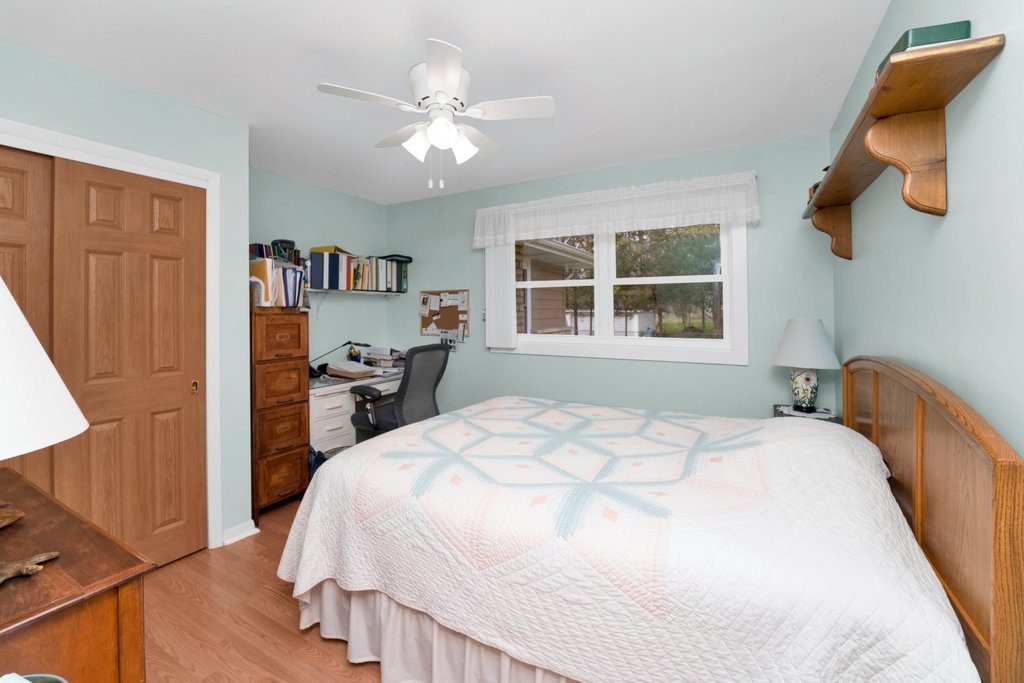 16 Tweed Road Fox Lake, IL 60020 - Photo 12 of 27 a bedroom with a bed and a window