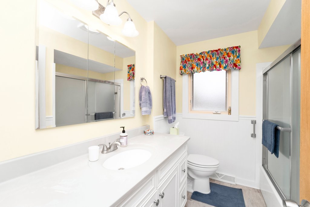 16 Tweed Road Fox Lake, IL 60020 - Photo 14 of 27 a bathroom with a sink vanity mirror and toilet