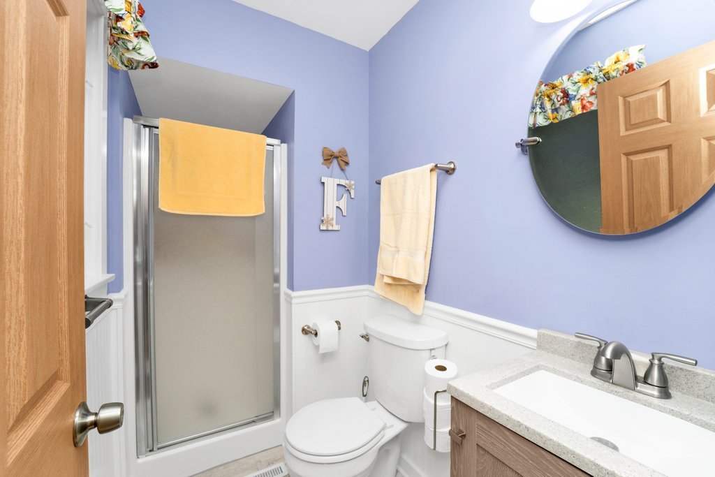 16 Tweed Road Fox Lake, IL 60020 - Photo 16 of 27 a bathroom with a granite countertop sink mirror vanity and toilet