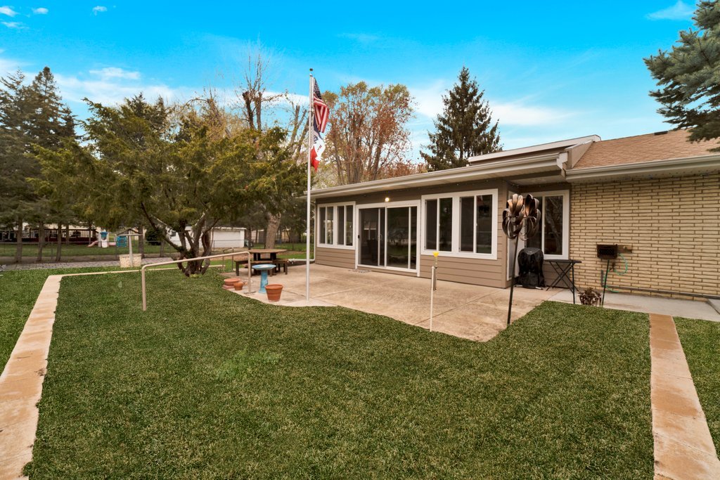 16 Tweed Road Fox Lake, IL 60020 - Photo 23 of 27 a view of a house with sitting area and garden