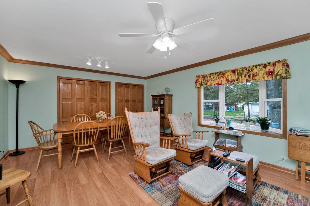 16 Tweed Road Fox Lake, IL 60020 - Photo 8 of 27 a dining room with furniture large windows and wooden floor