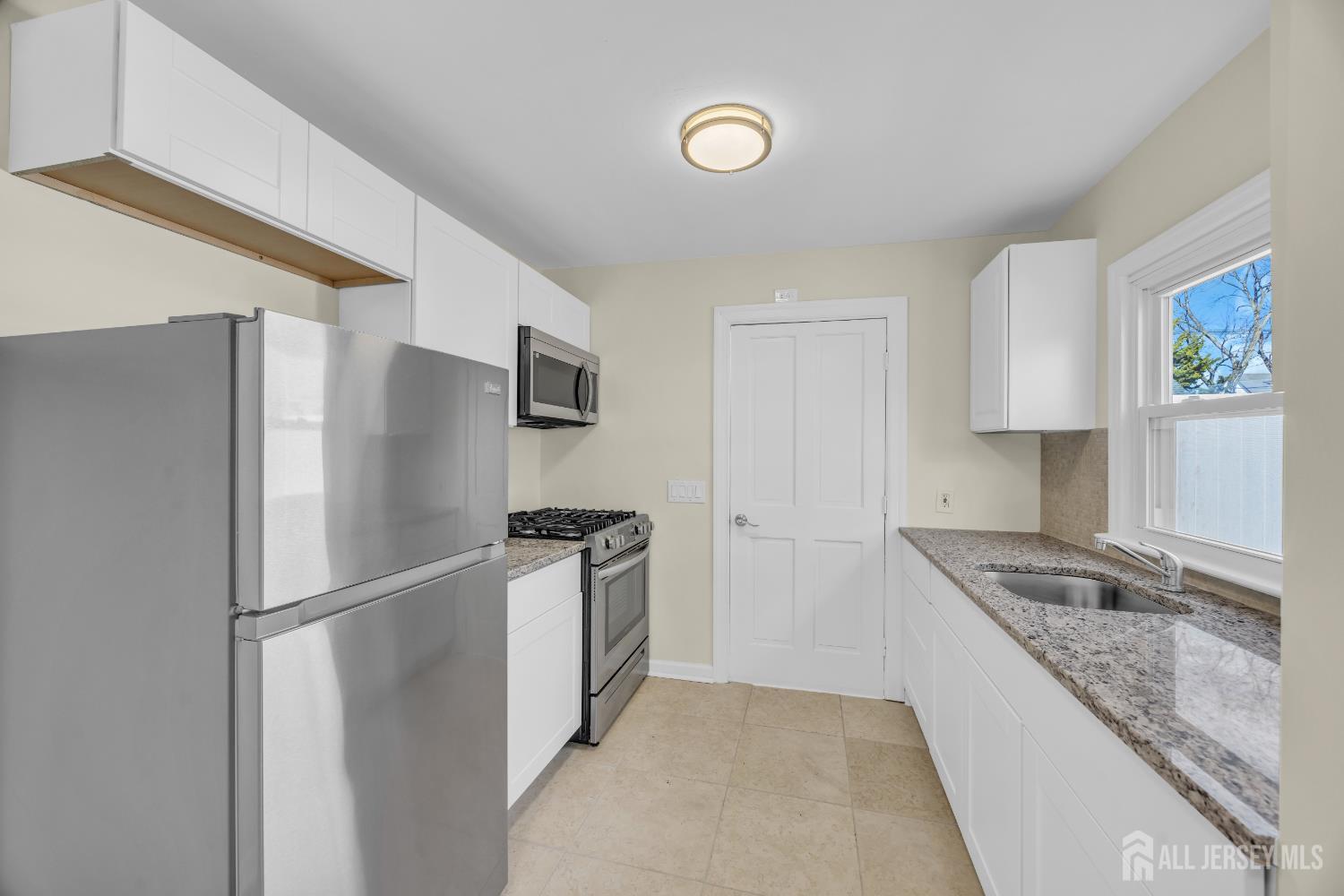 11 North Randolphville Road Piscataway, NJ 08854 - Photo 11 of 28 a kitchen with stainless steel appliances granite countertop a refrigerator and a sink