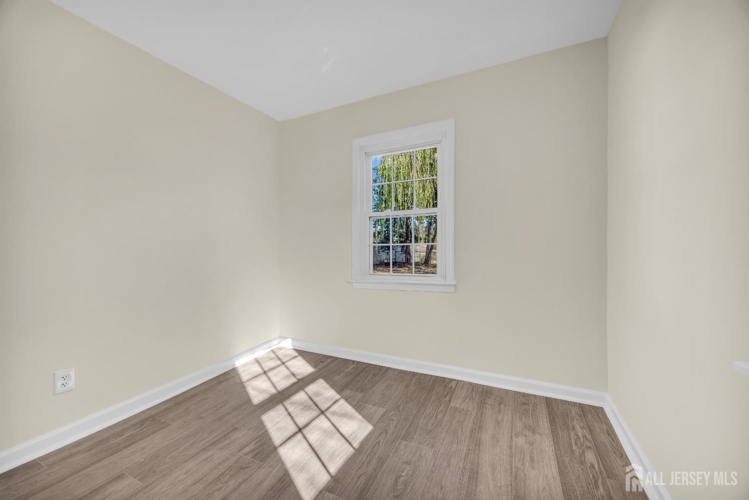 11 North Randolphville Road Piscataway, NJ 08854 - Photo 17 of 28 an empty room with wooden floor and windows