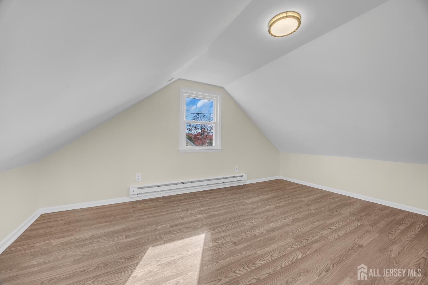 11 North Randolphville Road Piscataway, NJ 08854 - Photo 20 of 28 an empty room with wooden floor and windows