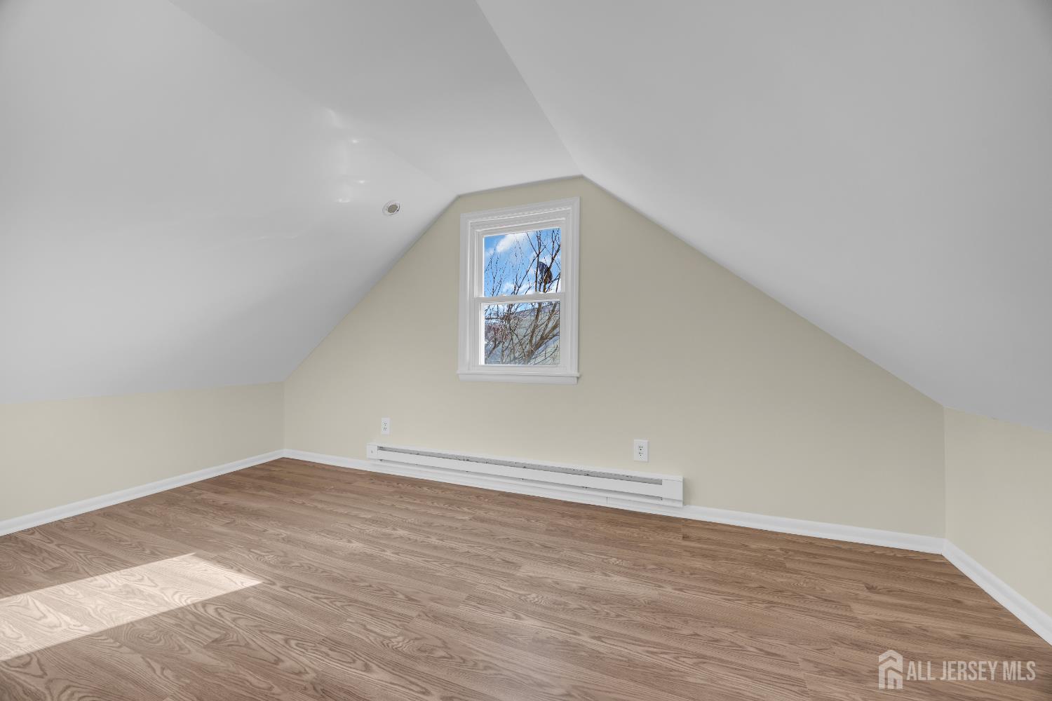 11 North Randolphville Road Piscataway, NJ 08854 - Photo 22 of 28 an empty room with wooden floor and windows